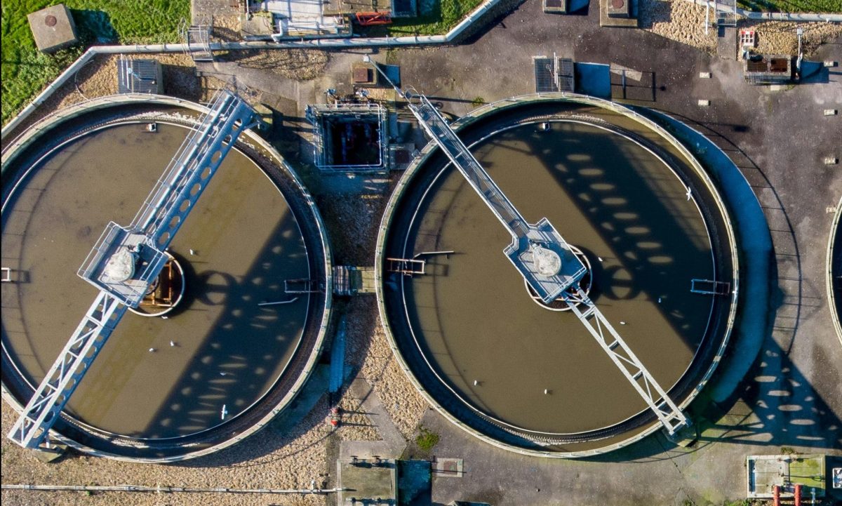 A large group of water tanks sitting next to each other