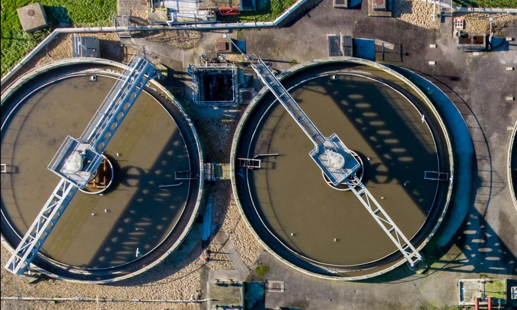 A large group of water tanks sitting next to each other