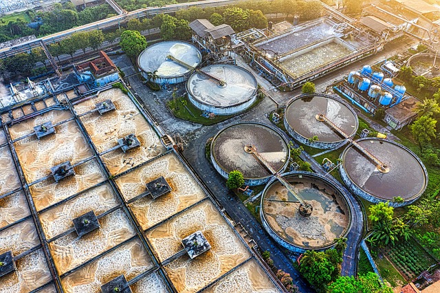 Image of a water treatment plant with tanks, pipes, and filtration systems used for purifying water.